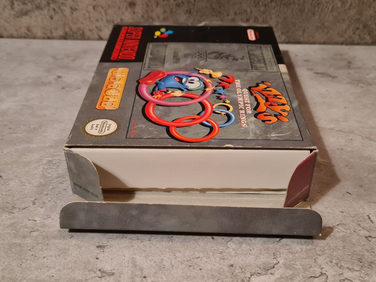 SNES Super Nintendo Izzy's Quest for the Olympic Rings mit OVP und Anleitung EUR - T-Retro-Games