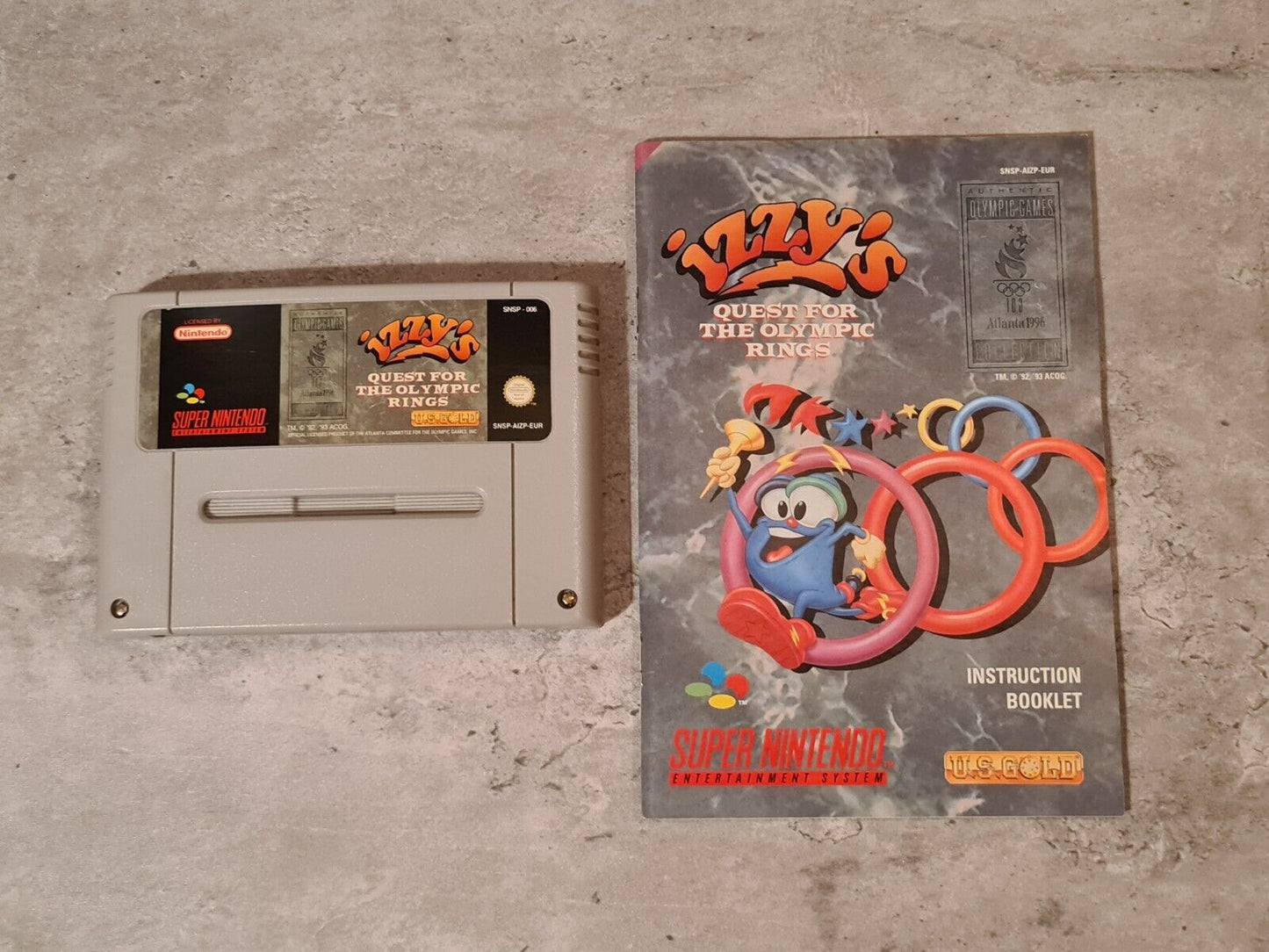 SNES Super Nintendo Izzy's Quest for the Olympic Rings mit OVP und Anleitung EUR - T-Retro-Games
