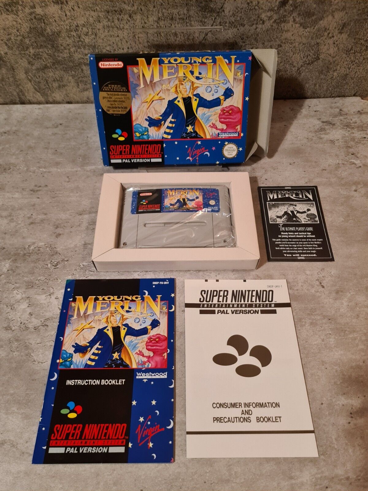 SNES Super Nintendo Young Merlin mit OVP und Anleitung + Players Guide UKV - T-Retro-Games