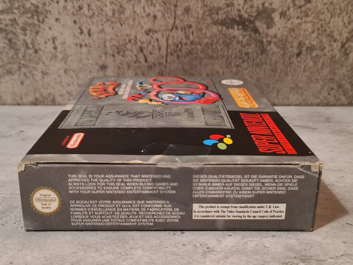 SNES Super Nintendo Izzy's Quest for the Olympic Rings mit OVP und Anleitung EUR - T-Retro-Games