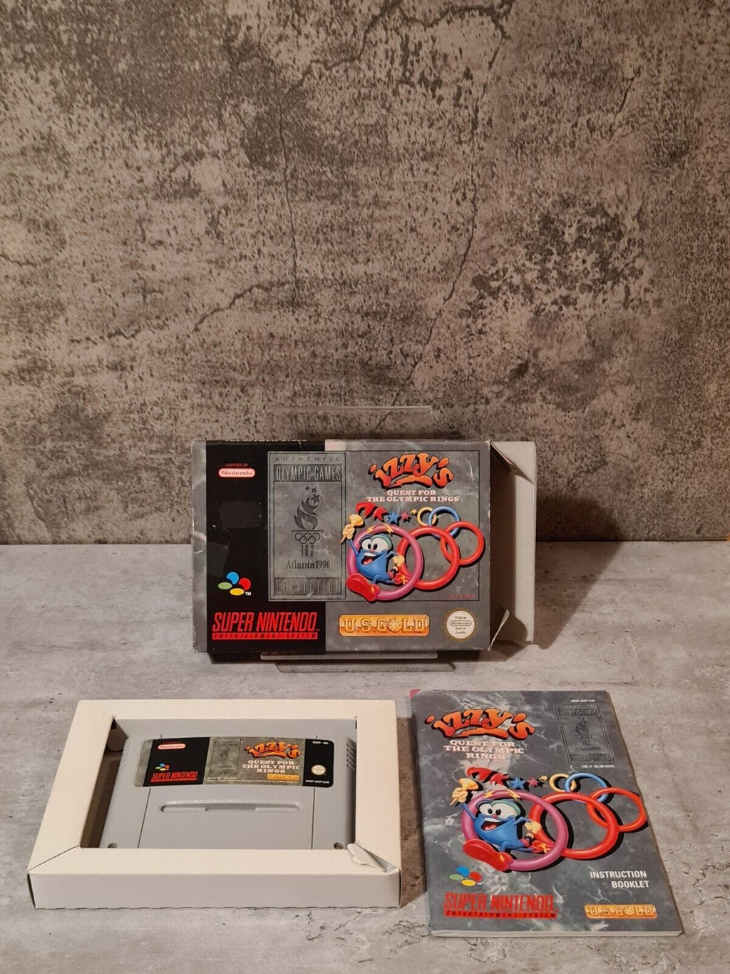 SNES Super Nintendo Izzy's Quest for the Olympic Rings mit OVP und Anleitung EUR - T-Retro-Games 